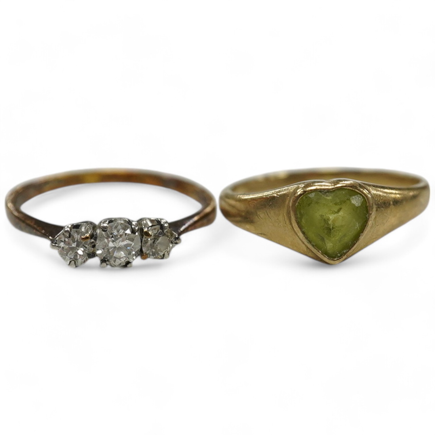 An 18ct and three stone diamond set ring, size G and one other 9ct gold and heart shaped green stone set ring. Condition - poor to fair